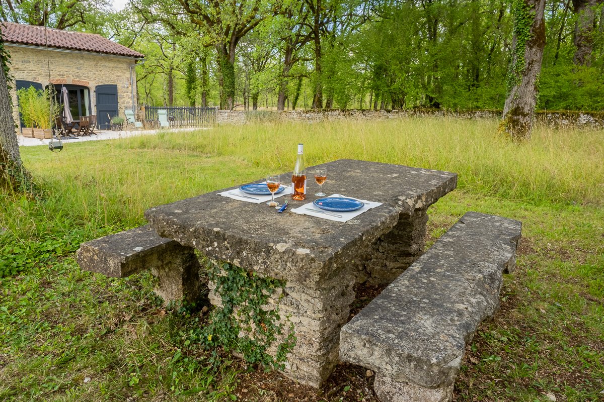 A Photograph of an Old Stone Table Outside the Gîtes at Quercy Photo Holidays, Lot, France
