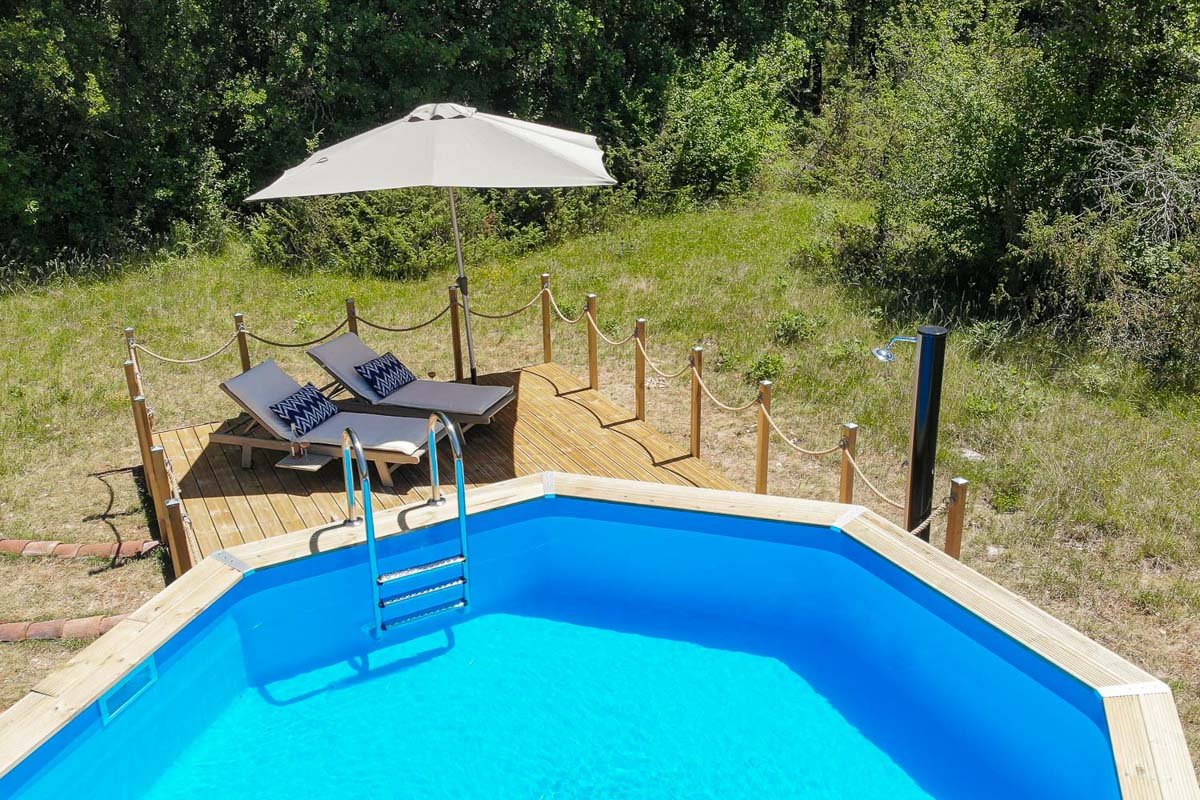 The Secluded Swimming Pool and Sun Deck at Quercy Photo Holidays, Lot, France A Photograph of the Secluded Swimming Pool and Sun Deck at Quercy Photo Holidays, Lot, France